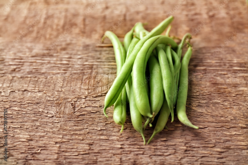 Fresh green beans on wooden background Fresh green beans on wooden background