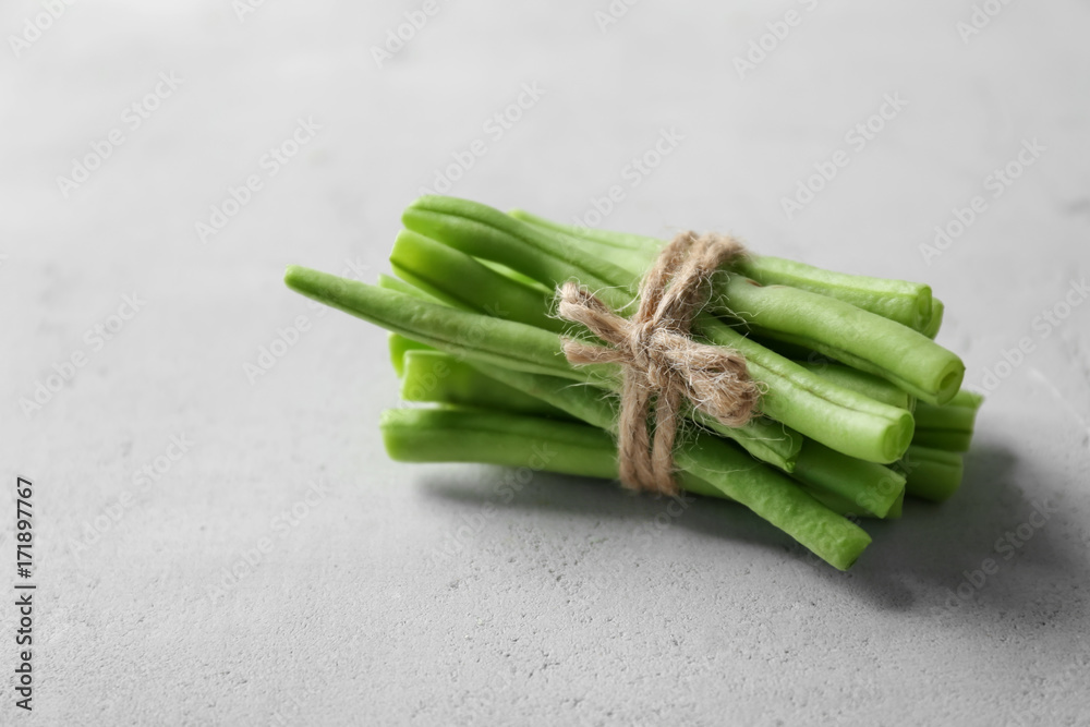 Bunch of fresh green beans on light background Bunch of fresh green beans on light background