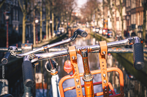 Orange Bike in Front of a Canal in Amsterdam, Netherlands