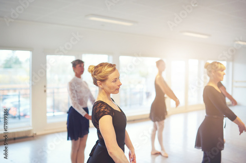Adult women dancing ballet and exercising in group © Flamingo Images