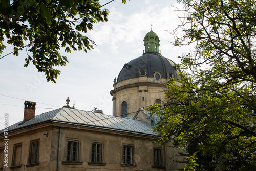 Lviv, Ukraine: Panorama of Pidvalna street with the dome of Dominican Church, Lvov and trees framing