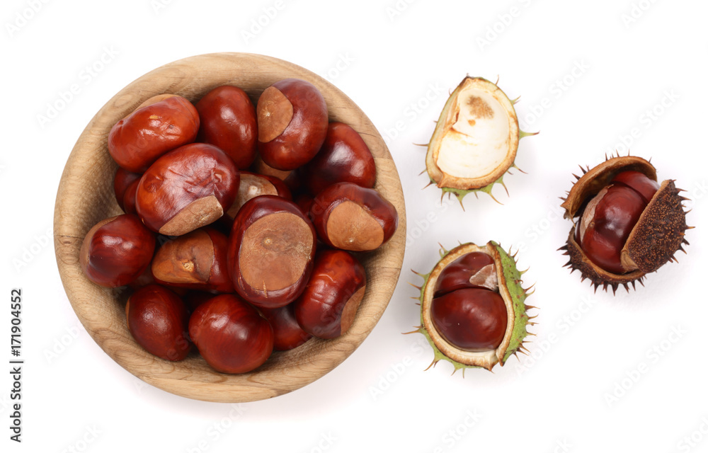 chestnut in a wooden bowl isolated on white background. Top view chestnut in a wooden bowl isolated on white background. Top view