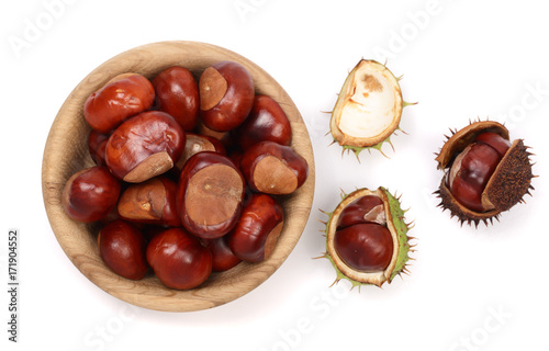 chestnut in a wooden bowl isolated on white background. Top view