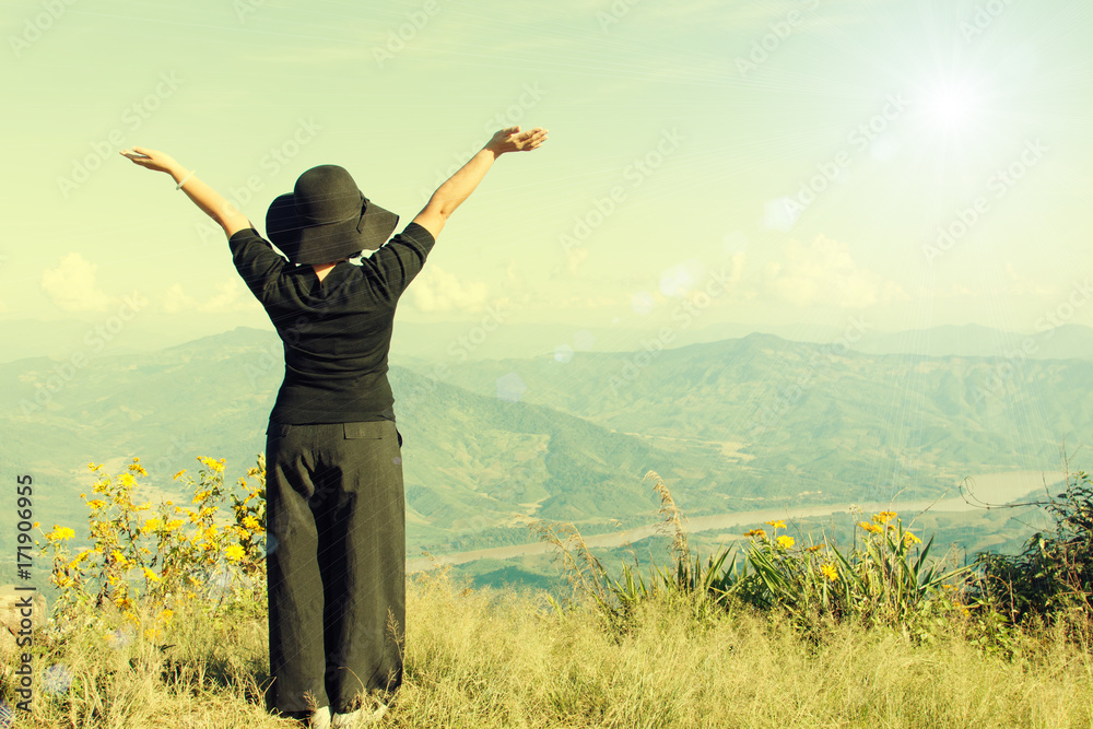 Tourist woman relaxing at mountain view landscape Tourist woman relaxing at mountain view landscape