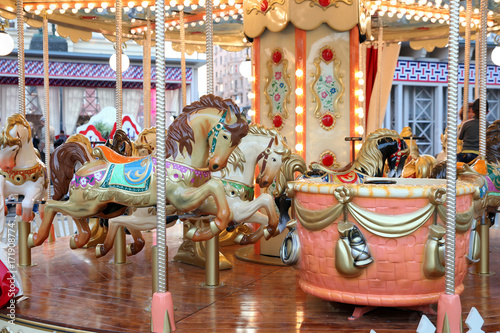 Children's carousel with horses at the fair