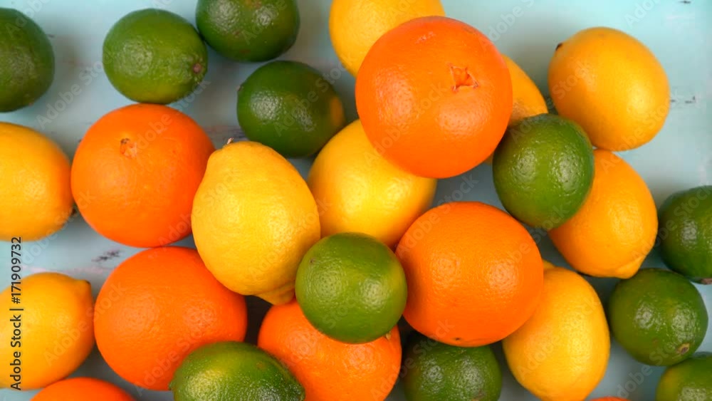 Colorful citrus fruit on aqua blue wood table timelapse. Colorful citrus fruit on aqua blue wood table timelapse.