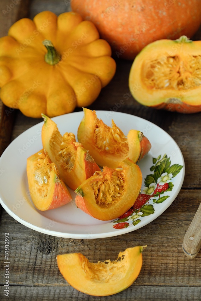 Delicious fresh orange pumpkin on wooden table Delicious fresh orange pumpkin on wooden table