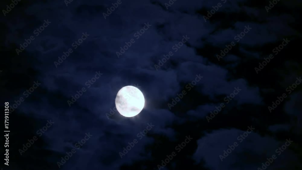 Full moon behind moving cloud at Black night Full moon behind moving cloud at Black night