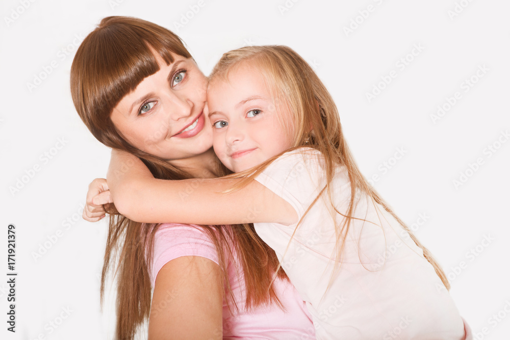 Portrait of beautiful mother and her daughter hugging. Happy family.
Portrait of beautiful mother and her daughter hugging. Happy family.