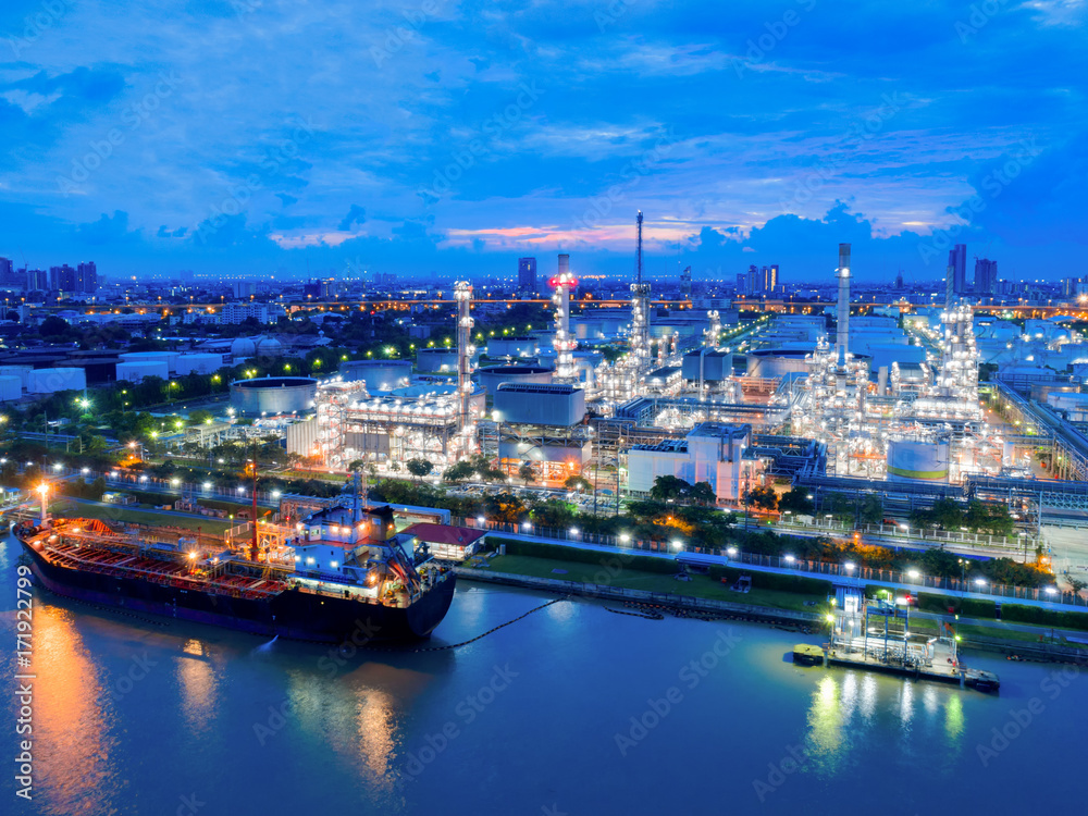 Aerial view of twilight of oil refinery ,Shot from drone of Oil refinery and Petrochemical plant at dusk , Bangkok, Thailand