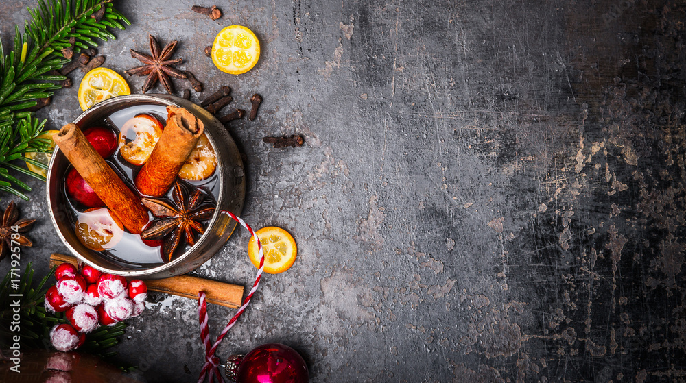 Mug with mulled wine and Christmas decoration on dark background, top view, place for text Mug with mulled wine and Christmas decoration on dark background, top view, place for text