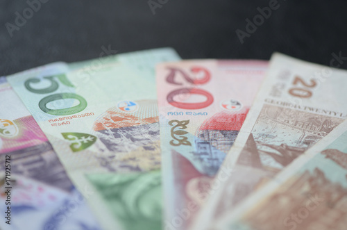 Some banknotes of Georgian lari on a dark background