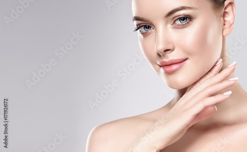 Beautiful Young Woman with Clean Fresh Skin . Facial  treatment   . Cosmetolo...