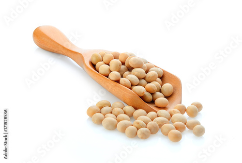 Soybean in wooden scoop isolated on white background