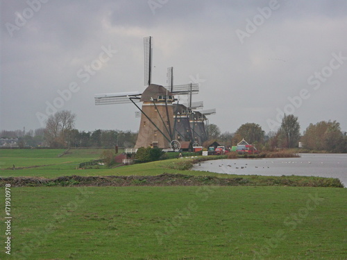 3 windmills in a row in Driemanspolder, the Netherlands photo