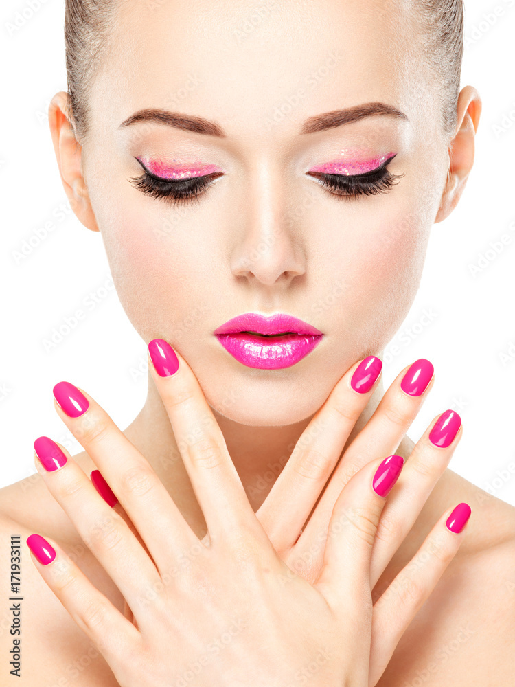 eautiful woman face with pink makeup of eyes and nails. eautiful woman face with pink makeup of eyes and nails.