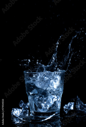 ice cube in the glass of water