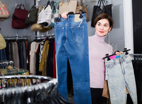 Customer examining jeans