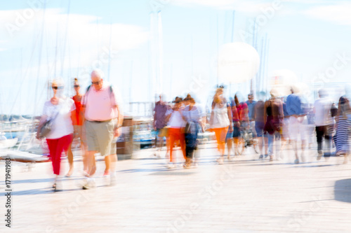 Cannes, ITALY. Le Vieux Port of Cannes. Blur of people walking on the Yachting festival in front of the main harbour