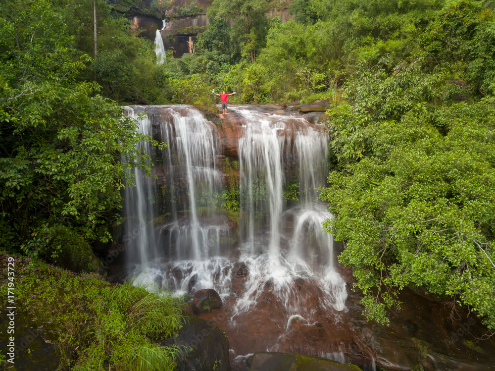 People lifestyle on big waterfalls.  in the middle of jungle and contemplating beauties of tropical forest with waterfalls.