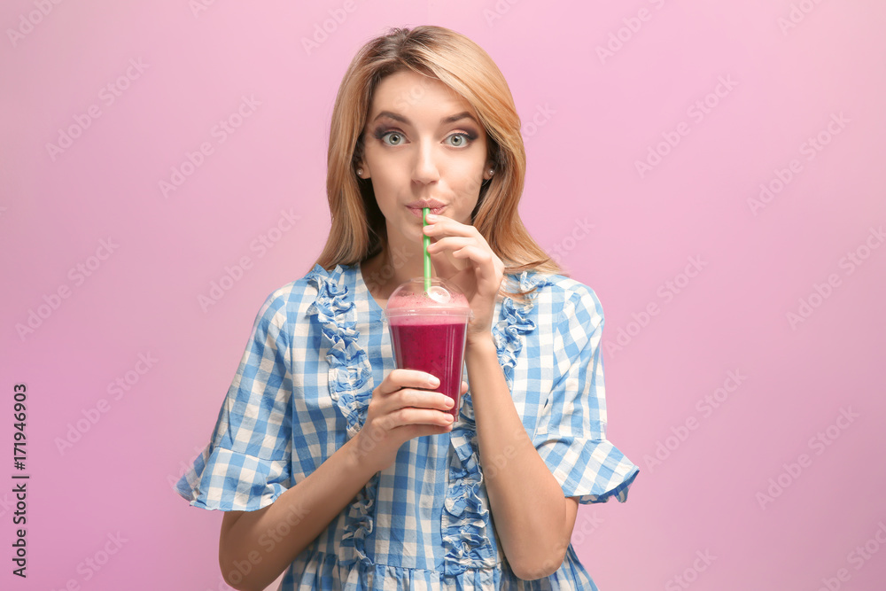 Beautiful young woman with fresh smoothie on color background Beautiful young woman with fresh smoothie on color background