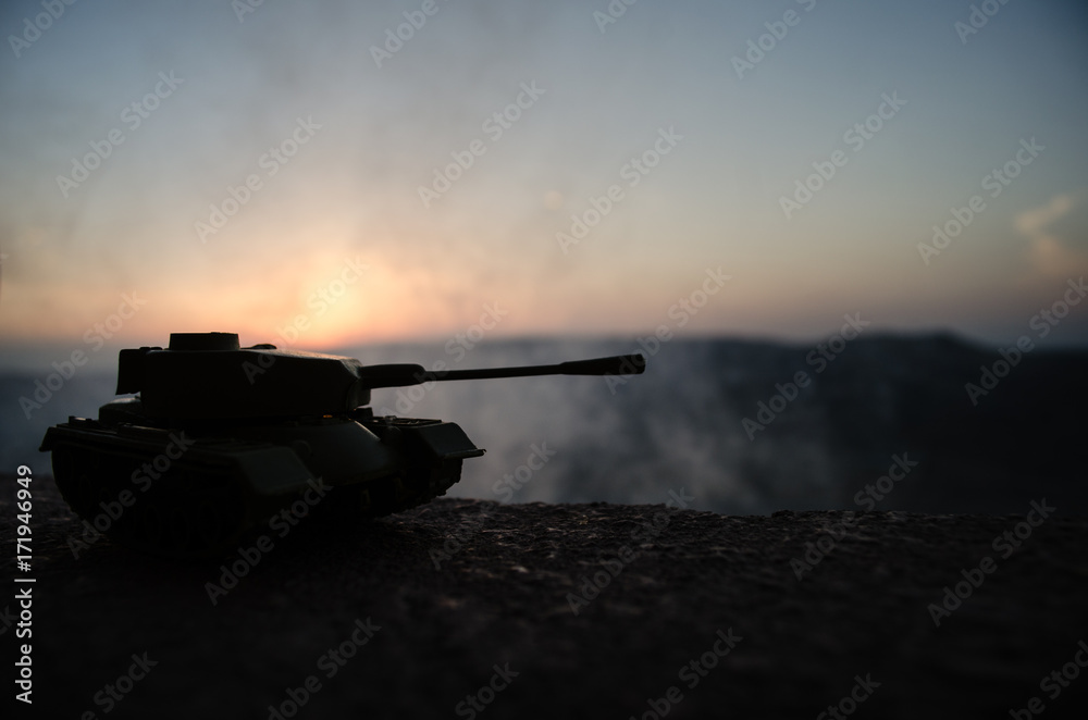 War Concept. Military silhouettes fighting scene on war fog sky background, World War Soldiers Silhouettes Below Cloudy Skyline at sunset. Armored vehicles. German tank in action