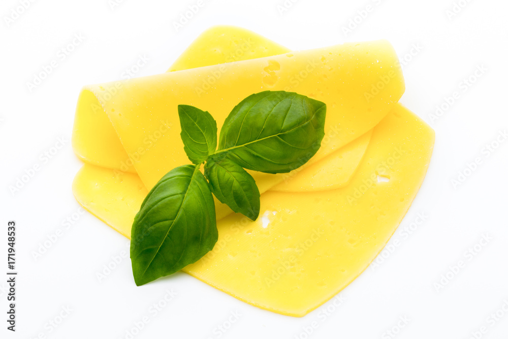 Cheese slices on the white background. Cheese slices on the white background.