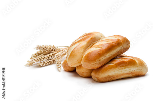 Mini  loaf bread and wheat ears isolated on white background