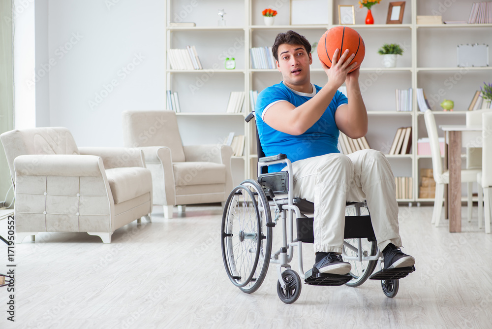 Young basketball player on wheelchair recovering from injury Young basketball player on wheelchair recovering from injury