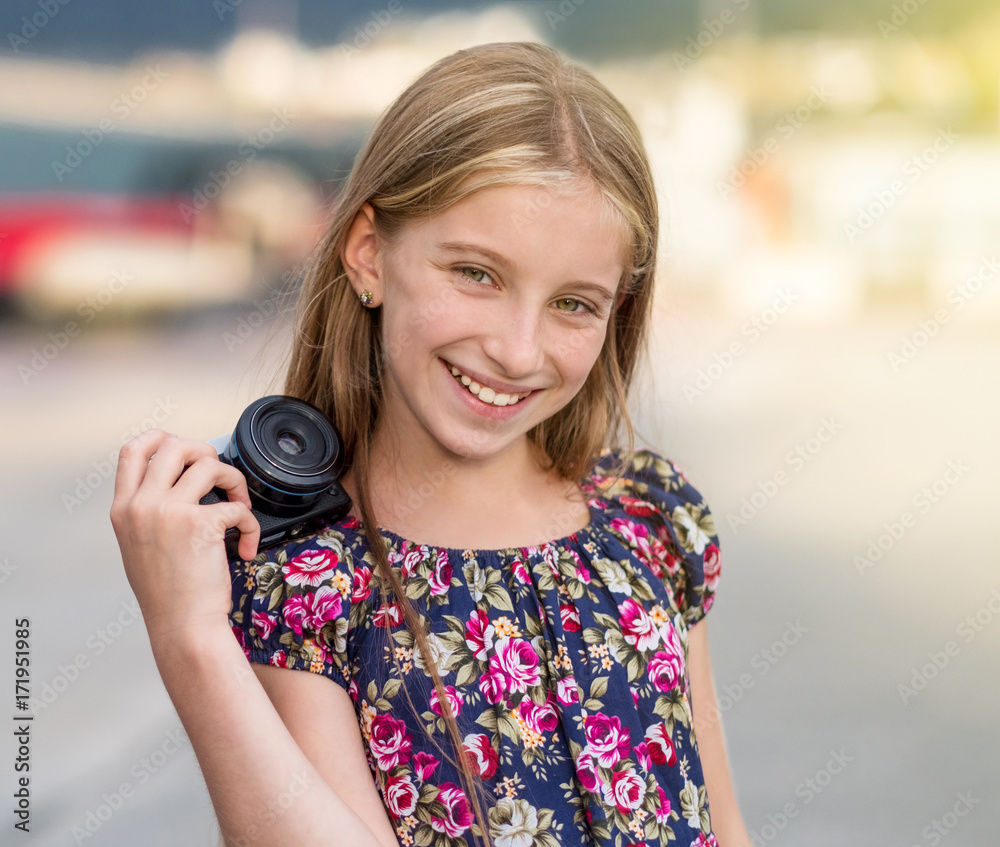Beautiful little girl with camera, summer outdoor Beautiful little girl with camera, summer outdoor