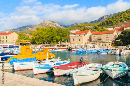 Row of traditional fishing boats in Bol port, Brac island, Croatia