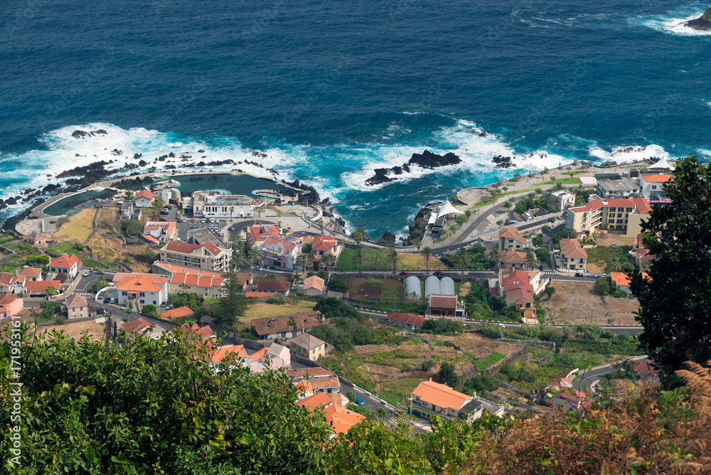 Top view of the village of Porto Moniz with lava-rock pool, Madeira Island, Portugal