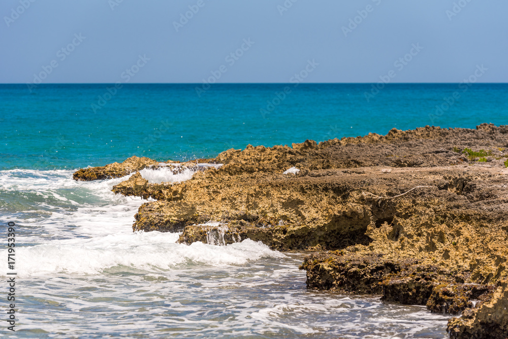 Rocky beach in Bayahibe, La Altagracia, Dominican Republic. Copy space for text.