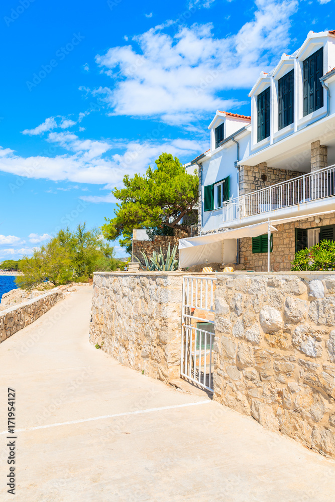 Apartments on coastal path along sea in Primosten old town, Dalmatia, Croatia