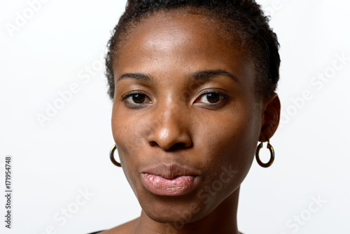 Pretty young African woman pouting her lips