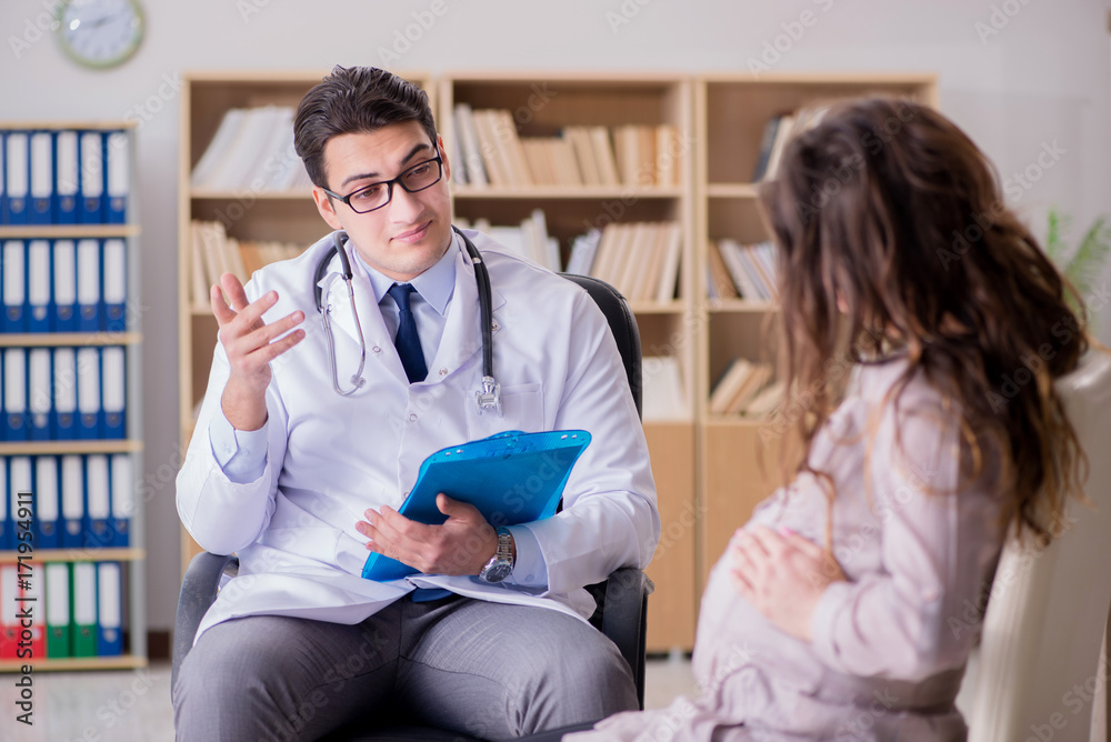Fototapeta premium Pregnant woman visiting doctor for consultation