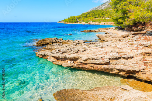 View of beautiful small beach and rocks near Zlatni Rat at Bol on Brac island in summertime, Croatia