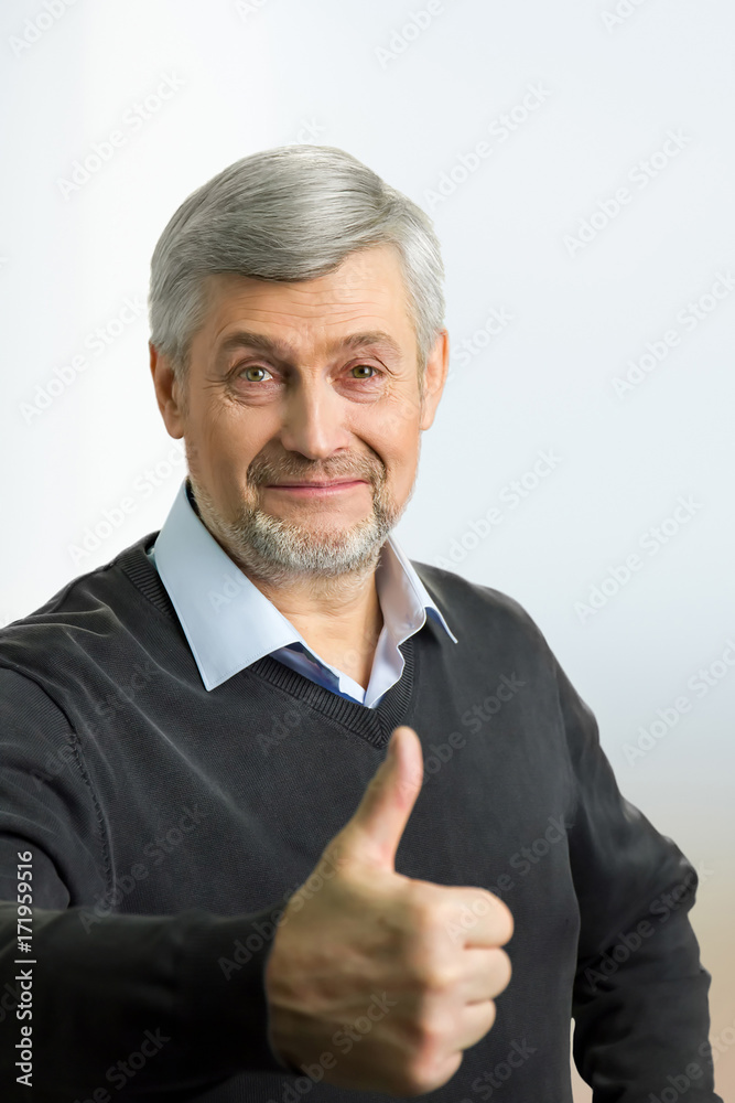 Mature man showing thumb up. Senior man show thumbs up, good gesture, isolated on white background. Mature man showing thumb up. Senior man show thumbs up, good gesture, isolated on white background.