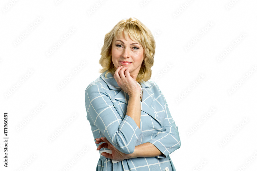 Portrait of attractive mature blonde. Middle aged woman holding hand on chin and looking at camera while standing on white background. Portrait of attractive mature blonde. Middle aged woman holding hand on chin and looking at camera while standing on white background.