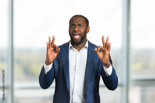 Fotografie Black businessman gesturing OK