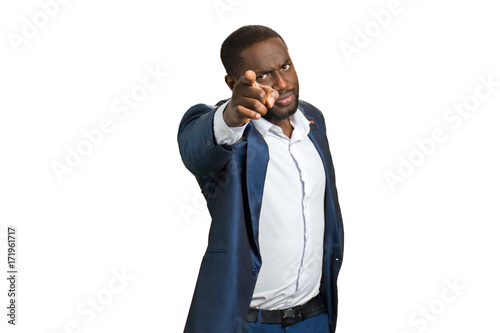 Confident buainessman pointing at camera. Handsome black man pointing on white background.