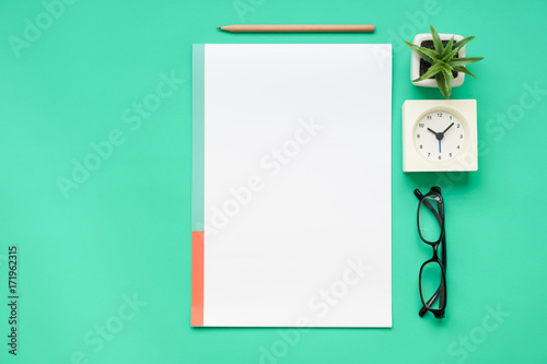 Top view of office desk with stationery items