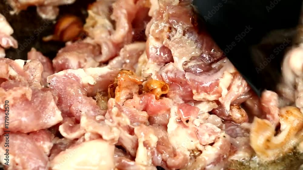 frying pork in pan frying pork in pan