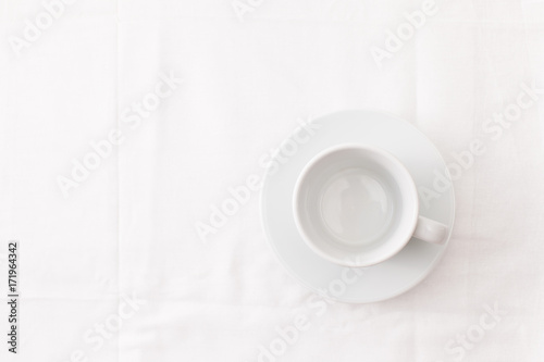 Empty white Cup of tea on white. Place for text.