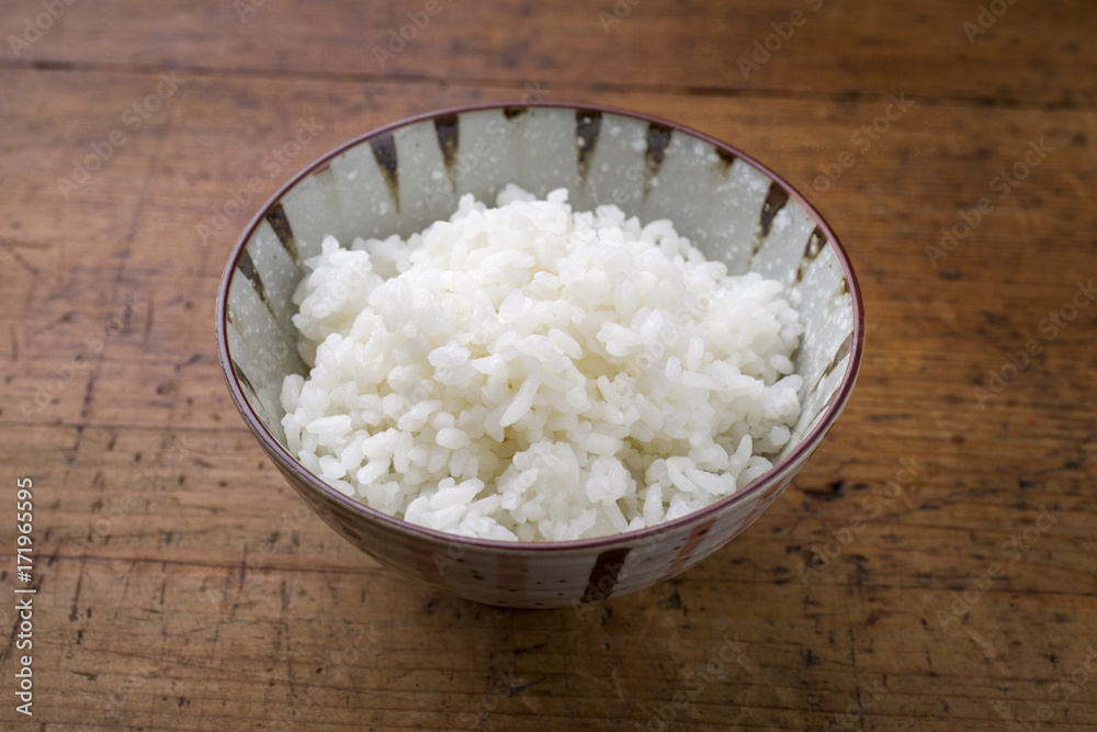 Traditional Japanese koshihikari rice as close-up in a bowl Traditional Japanese koshihikari rice as close-up in a bowl