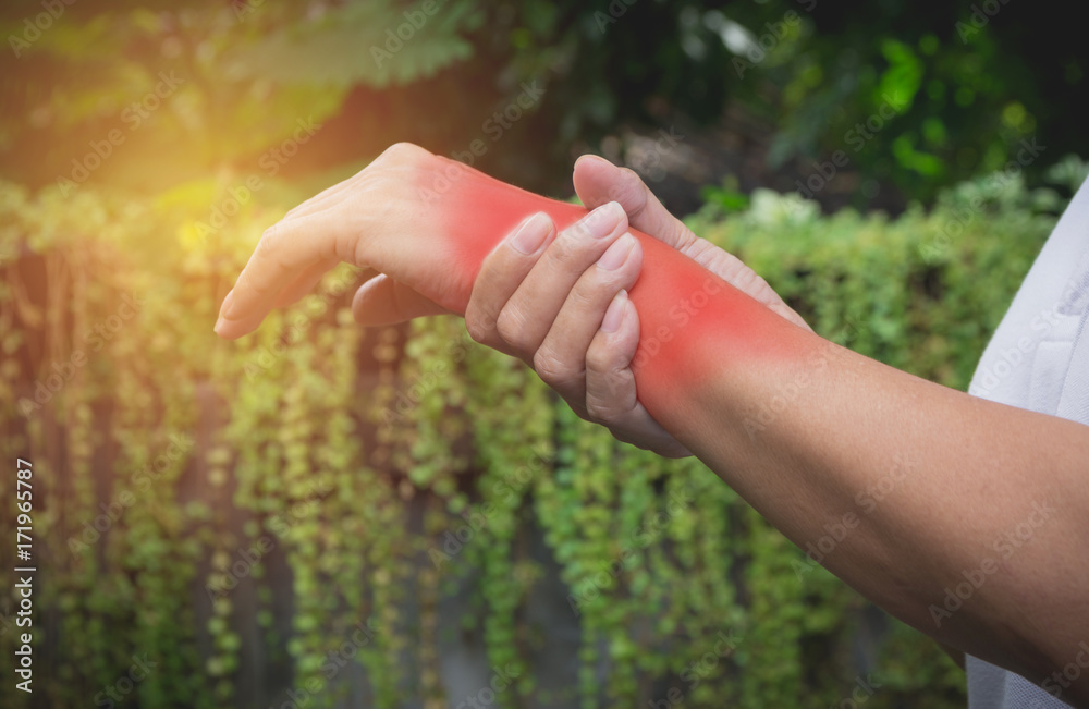 Man holding his wrist. Pain in a man wrist. Man massaging painful wrist. pain concept. Man holding his wrist. Pain in a man wrist. Man massaging painful wrist. pain concept.