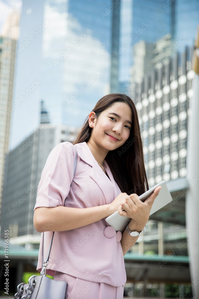 Fototapeta premium Young asian business lady working outdoors