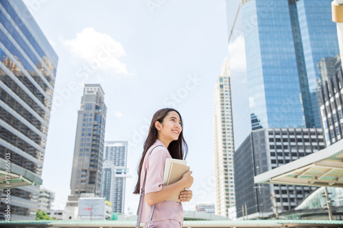 Young asian business lady  working outdoors © kapturephoto