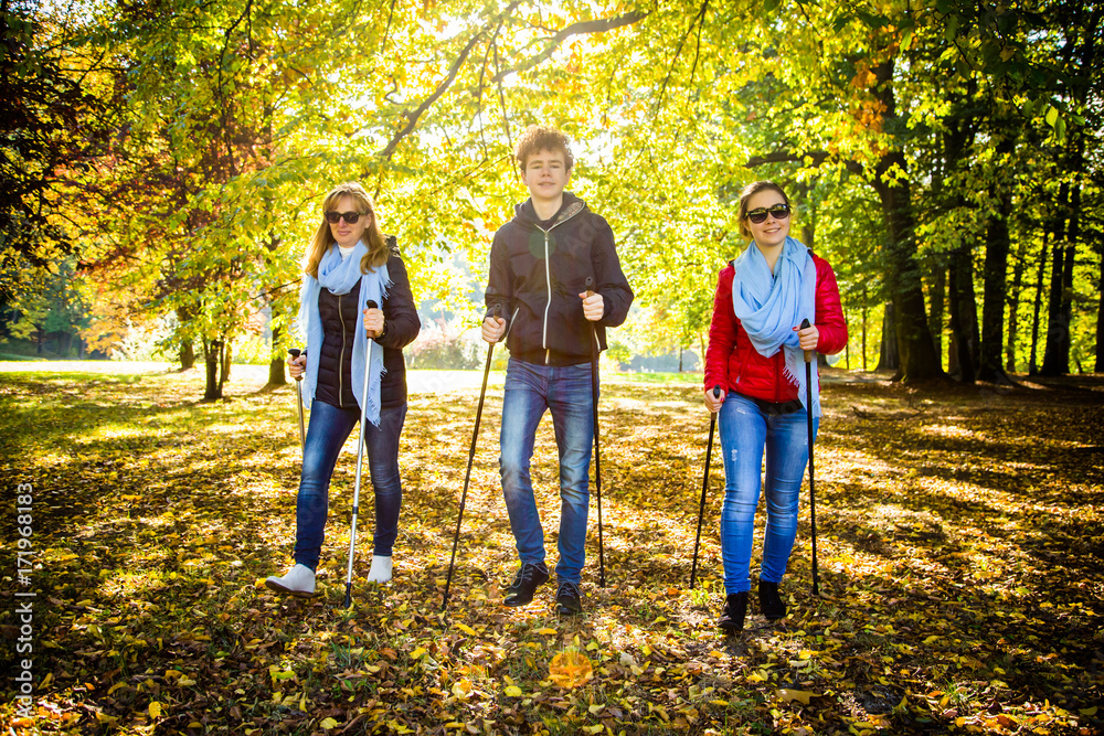 Fototapeta premium Nordic walking - active people working out 
