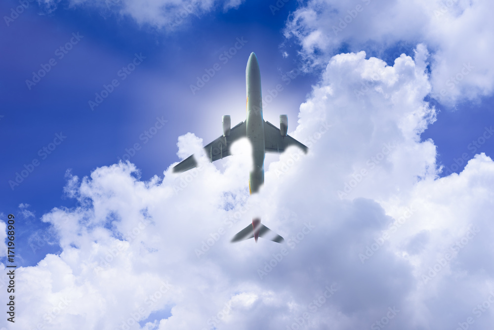 Fototapeta premium Airplane has takeoff in the blue sky background and white big cloud at sunrise in the morning on vacation and relax time. Travel, Journey, Vacation and Recreation concept.